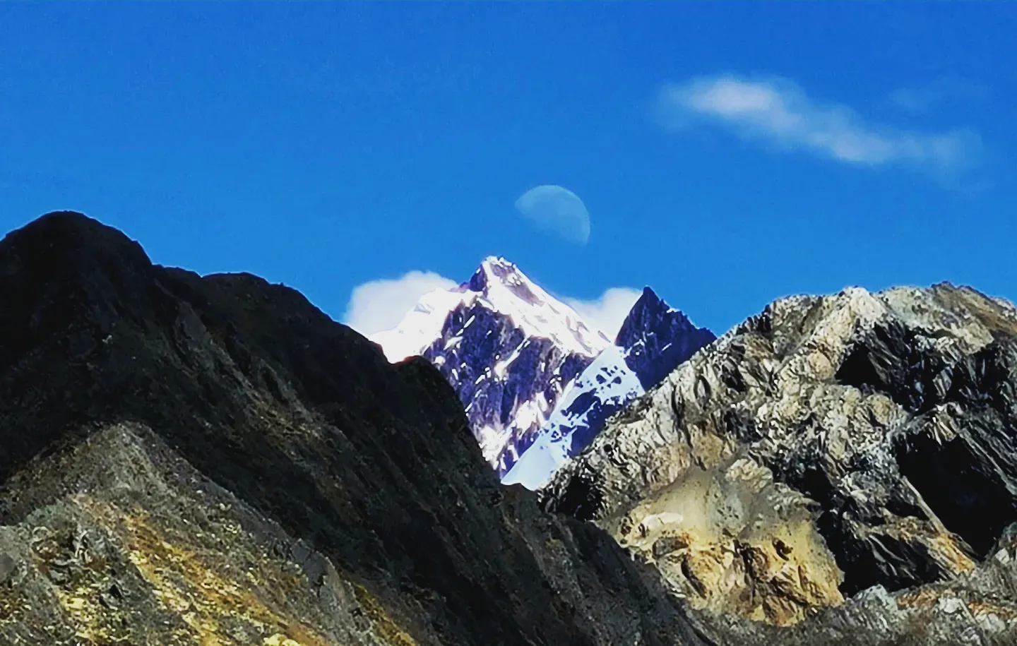 "Moonrise over the Apus  -  (In Quechua, "apu" is the name for mountain spirit. Pictured here in the center is Nevado Ausangate, one of the most sacred mountains, which according to legend fell to earth from the stars and sends water throughout the Sacred Valley.)" -Katie Foster