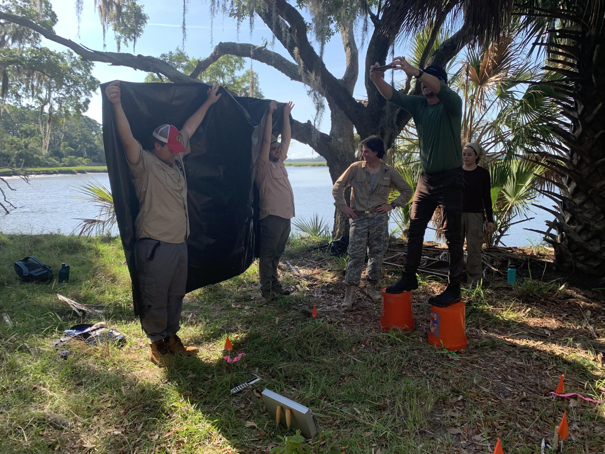 Photo from the 2022 UGA field school of us attempting to prevent the sun from being in the picture of our excavation unit." -Reyd Mahan