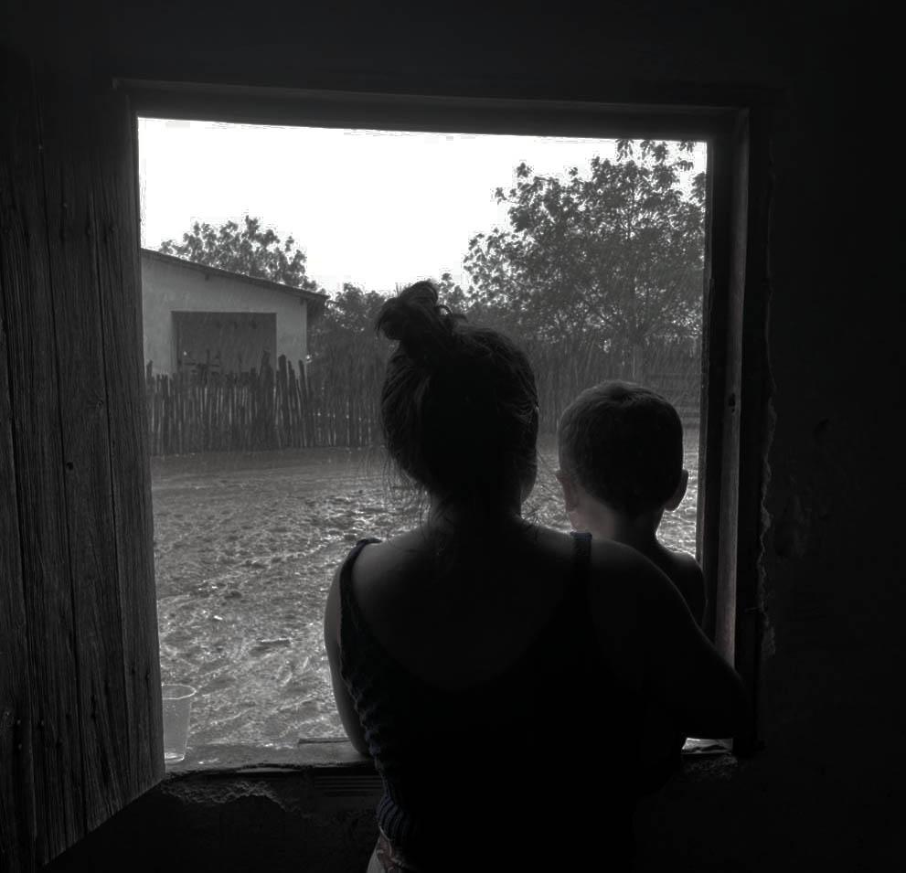 "One More Christmas Gift." On the morning of December 26—a day after all the Christmas presents have been opened—a mother and son share one more gift in the rural area of Quixeramobim, Ceará, Brazil: a glimpse of the first rains of the season."-Cydney Seigerman, Graduate 2nd Place