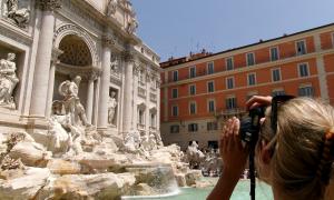 Jordan Cutts: Here, a student photographs the details of the Trevi Fountain in Rome, Italy, taking special notice of cultural impacts the high tourism rate has on the centuries-old marvel.