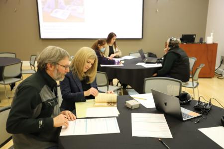 Drs. Gragson and Mittelstadt at a table