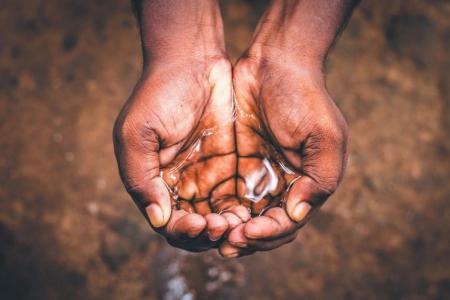 hands holding water