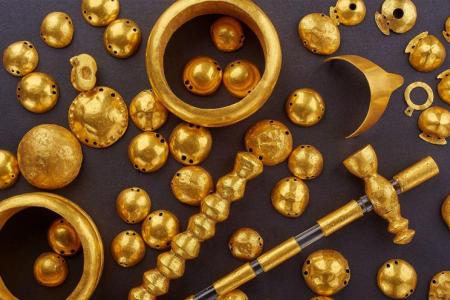These gold objects include bracelets, dress appliqués, a miniature diadem, pendants and a scepter. They were found in Varna, Bulgaria, and indicate hierarchy and status. They date to the late Copper Age, 4600-4400 B.C. The Varna Regional Museum of History in Bulgaria contributed the artifacts. (Photo by Ádám Vágó)
