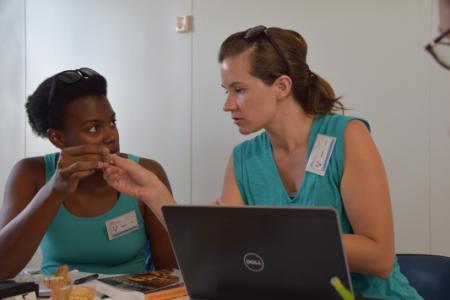 Laurie Reitsema (right) and a student do computer research.
