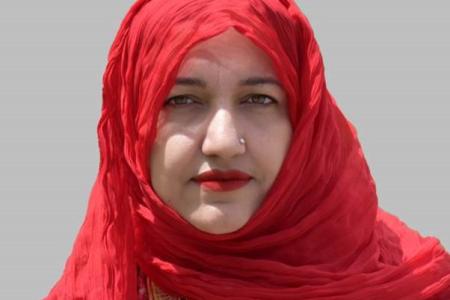 Dr. Saadia Sultan Wahla wearing red scarf