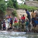 People in Zanzibar buzy on a riverbank.