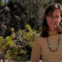 Sarah Hitchner outdoors with mountain, scrub background