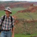 Archaeologist Robert Kelly stands before dramatic mesas